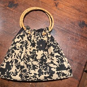 Bamboo ring handle pattern hand bag.